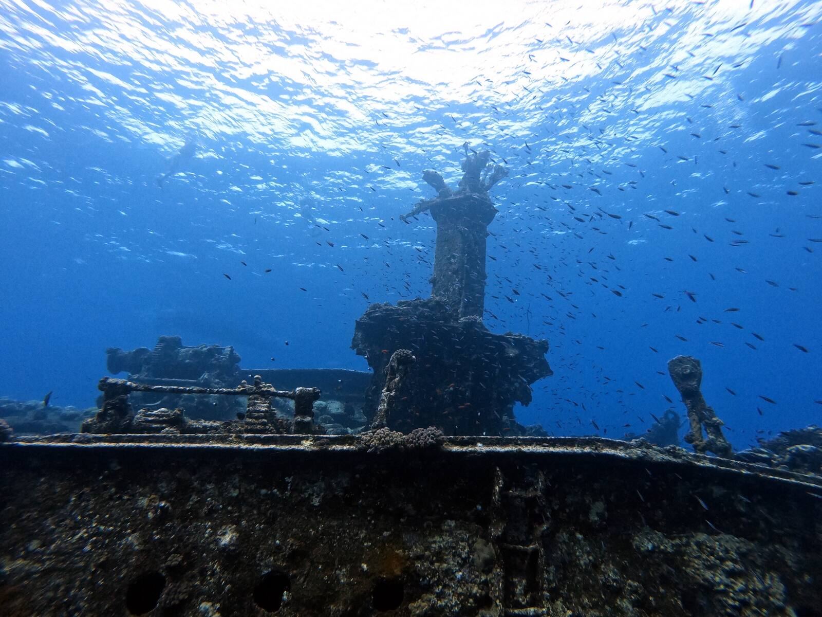 A wreck's upper deck under a bright surface